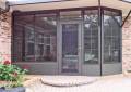 porch-enclosure-fill-in-black-big-windows-brick-house-eastern-sunrooms