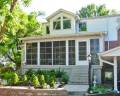 porch-enclosure-fill-in-white-big-windows-brick-house-eastern-sunrooms