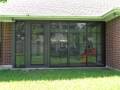 porch-enclosure-fill-in-black-big-windows-eastern-sunrooms